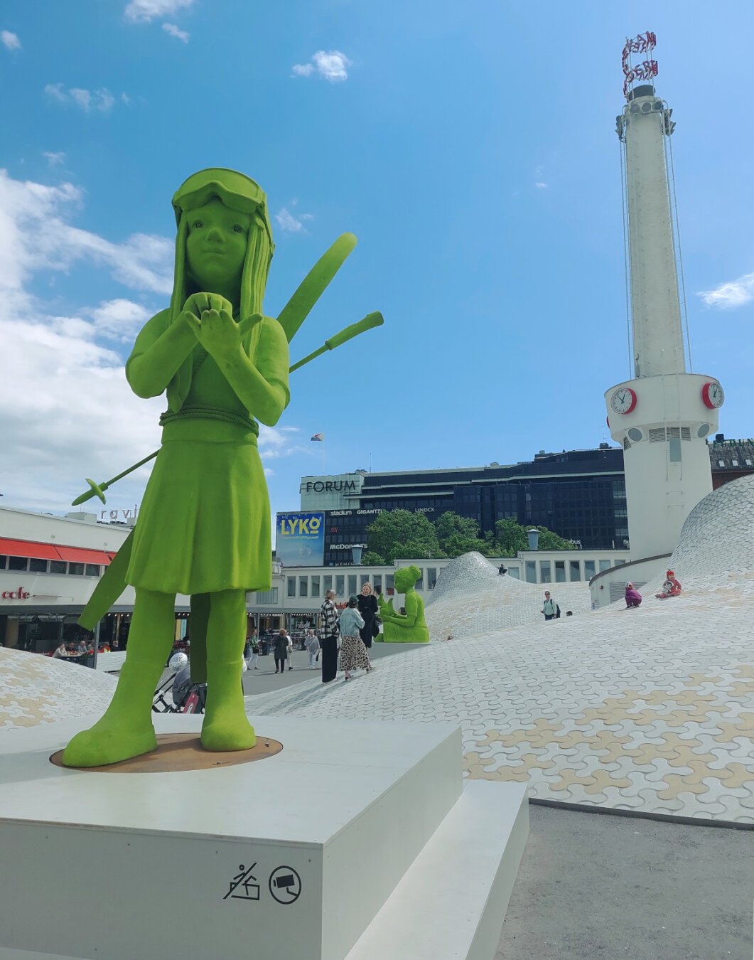 green statues in Helsinki, Finland