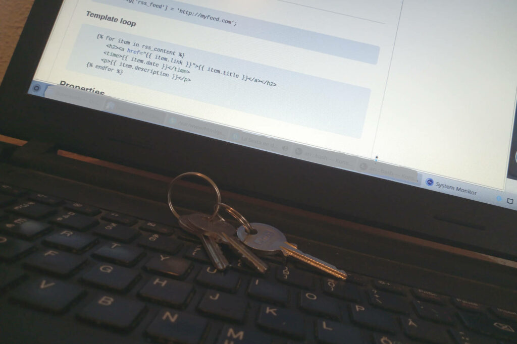 keys on laptop keyboard, screen displays program code